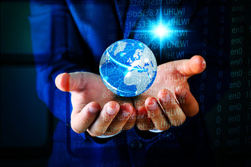 Sticker - Businessman holding digital earth in hands. Technology concept.