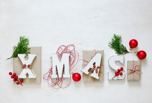 Xmas Word On A Wooden Background