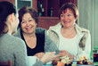 © JackF - Young female and mature women drinking tea and talking