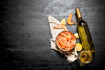 Wall Mural - bottle of white wine with shrimp and lemon.