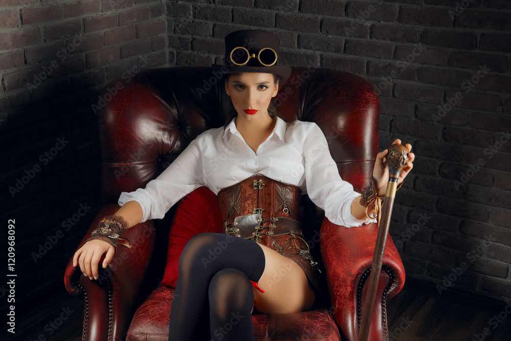Close-up portrait of a beautiful steampunk girl in lingerie and stockings  sitting in old armchair. Stock Photo | Adobe Stock