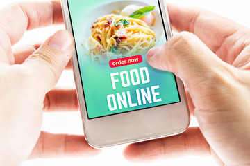 Close up Two hand holding mobile phone with food online word and