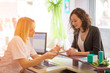 © Production Perig - Beautician woman discussing with a customer at the store