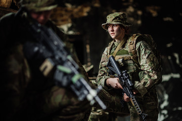 Soldiers on patrol in destroyed city. Military and rescue operation