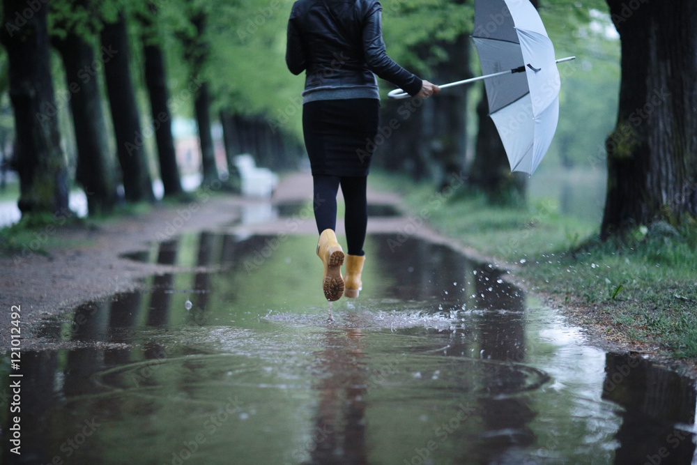 feet in rubber boots rain puddle city Stock Photo | Adobe Stock