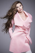 © dorriss - Beautiful long-haired woman in pink coat