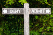 © stanciuc - DENY versus ADMIT directional signs
