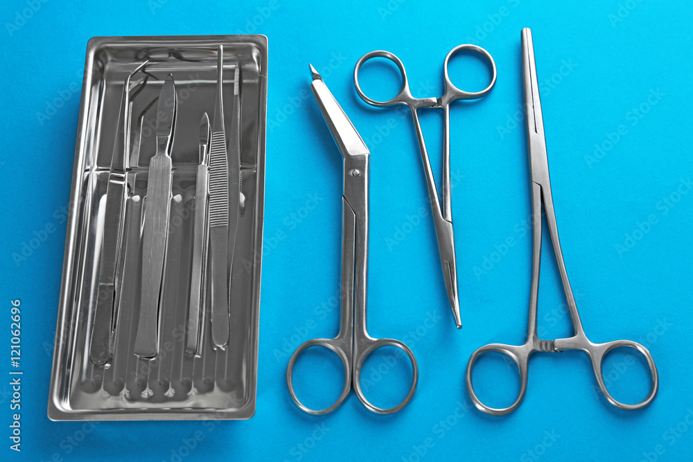 Flat lay of medical instruments on blue background