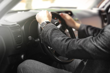 Businessman driving a car