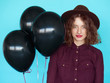 © kegfire - Sensual stylish young woman witn black balloons