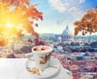 Cup of coffee in Rome with view of st Peters cathedral, Italy . Hot drink in autumn time. Colored vintage style picture