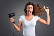 Young Woman With A Hairdryer 	