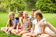 © Syda Productions - group of happy kids or friends outdoors
