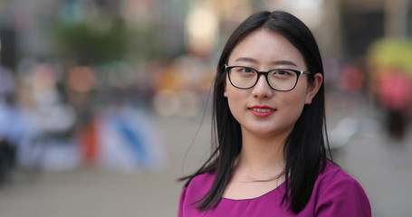 Young Asian woman in city face portrait