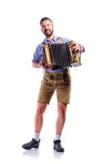 Wall Mural - Man in traditional bavarian clothes playing accordion. Oktoberfe