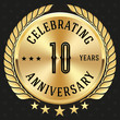 Gold celebrating 10 years badge, button on black background