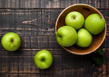 Green Organic Healthy Apples In Bowl On Wooden Board