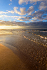 Wall Mural - Beautiful sandy Debki beach with waves at sunset time.  Baltic Sea, Poland. 