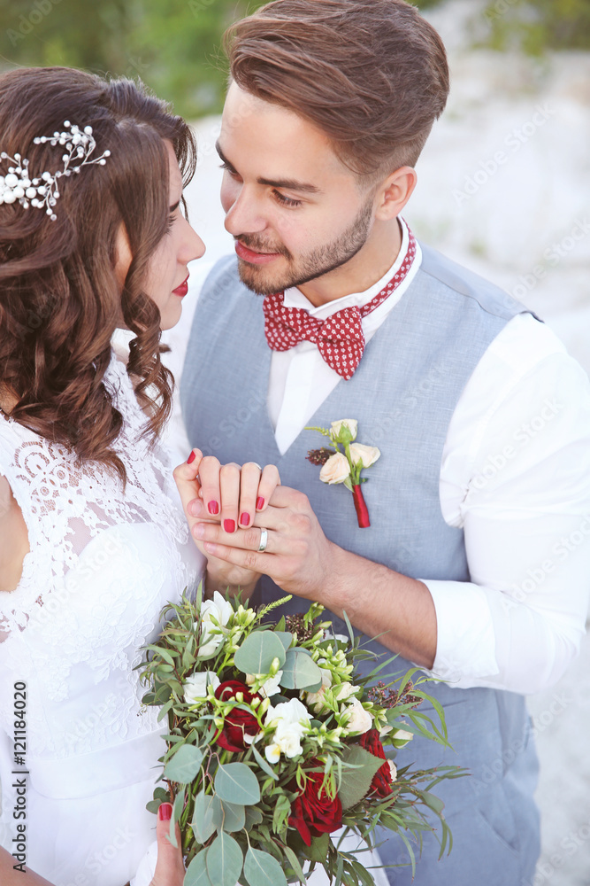 Bride and groom at their wedding day outdoors