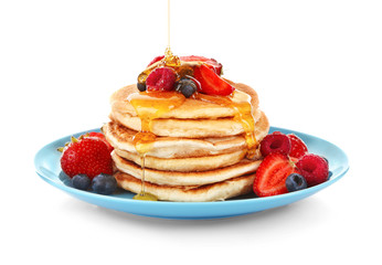 Wall Mural - Tasty pancakes with fresh berries and sweet honey on plate, isolated on white