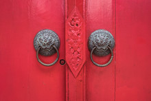 Red Door With Metal Knocker In Chiang Mai University