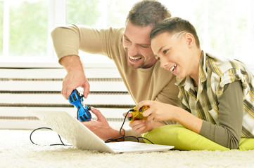 Poster - father and son playing computer game