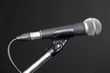 © lmanju - Microphone over grey background