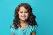 © Alezhano - portrait of a happy, positive, smiling, little girl, cyan background