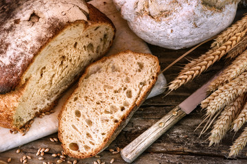 Wall Mural - Freshly baked bread in rustic setting