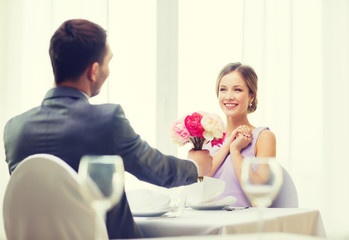 Wall Mural - smiling woman recieving bouquet of flowers