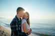 © kurapatka - young loving couple walking on beach