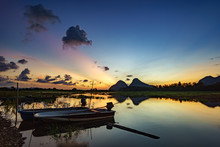 Beautiful Majestic Sunrise By The Lakeside With Fishing Boats. Nature Rural Landscape.