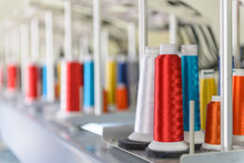 Colorful Spools Of Thread On An Industrial Sewing Machine.