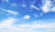 Leinwandbild Motiv Blue sky background with tiny clouds