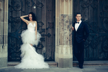 wedding sexy couple near wooden iron door