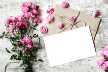 Bouquet Of Tender Pink Roses With A Blank Greeting Card And Envelope