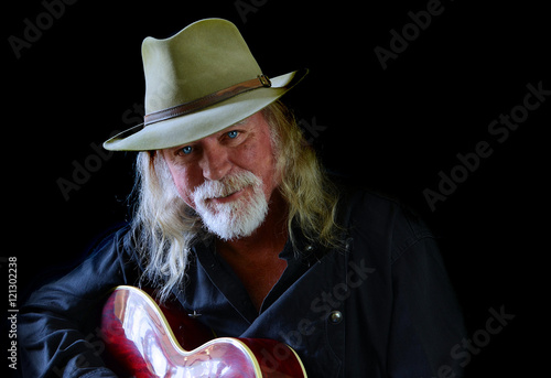 Portrait Of A Middle Aged Caucasian Man With Long Hair And A White