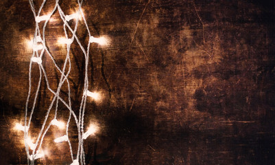Wall Mural - christmas lights garland on a old antique wooden parquet floor