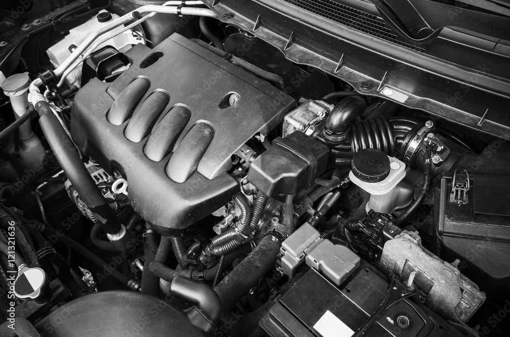 The engine is under the. Modern car engines. image of engine hood open.