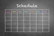 Timetable schedule on black chalkboard background