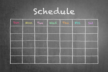 Timetable Schedule On Black Chalkboard Background