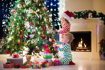 Wall Mural - Kids decorating Christmas tree