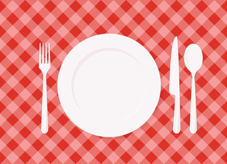 Empty plate on red checkered tablecloth