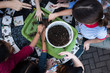Diverse kids using soil to plant seeds 