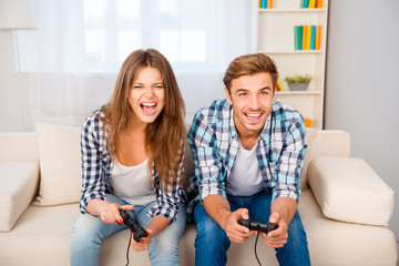 Sticker - Happy man and woman with joysticks playing video games