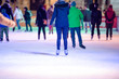 © Halfpoint - People ice skating at night in Vienna, Austria. Winter.
