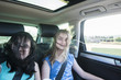 © cwzahner - Two girls having fun on a backseat of a car