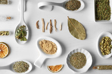 Flat Lay Of Assorted Herbs And Spices On White Background