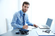 © Africa Studio - Male doctor at work in clinic office