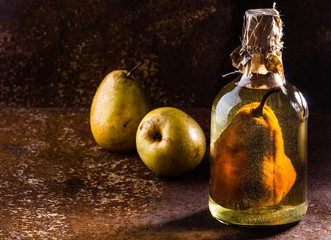 Chilean brandy with whole pear inside bottle. Aguardiente de pera